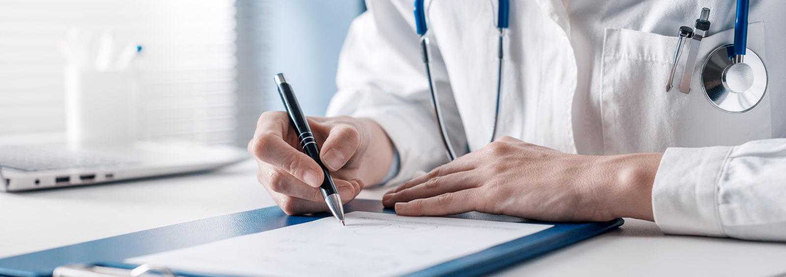 Doctor Writing A Medical Prescription